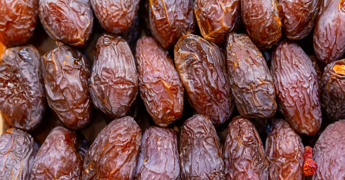 Detailed shot of fresh ripe dates in rows, ideal for food and health topics.